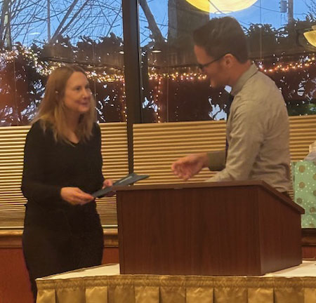 Dr. Kathy Stevens receiving an award